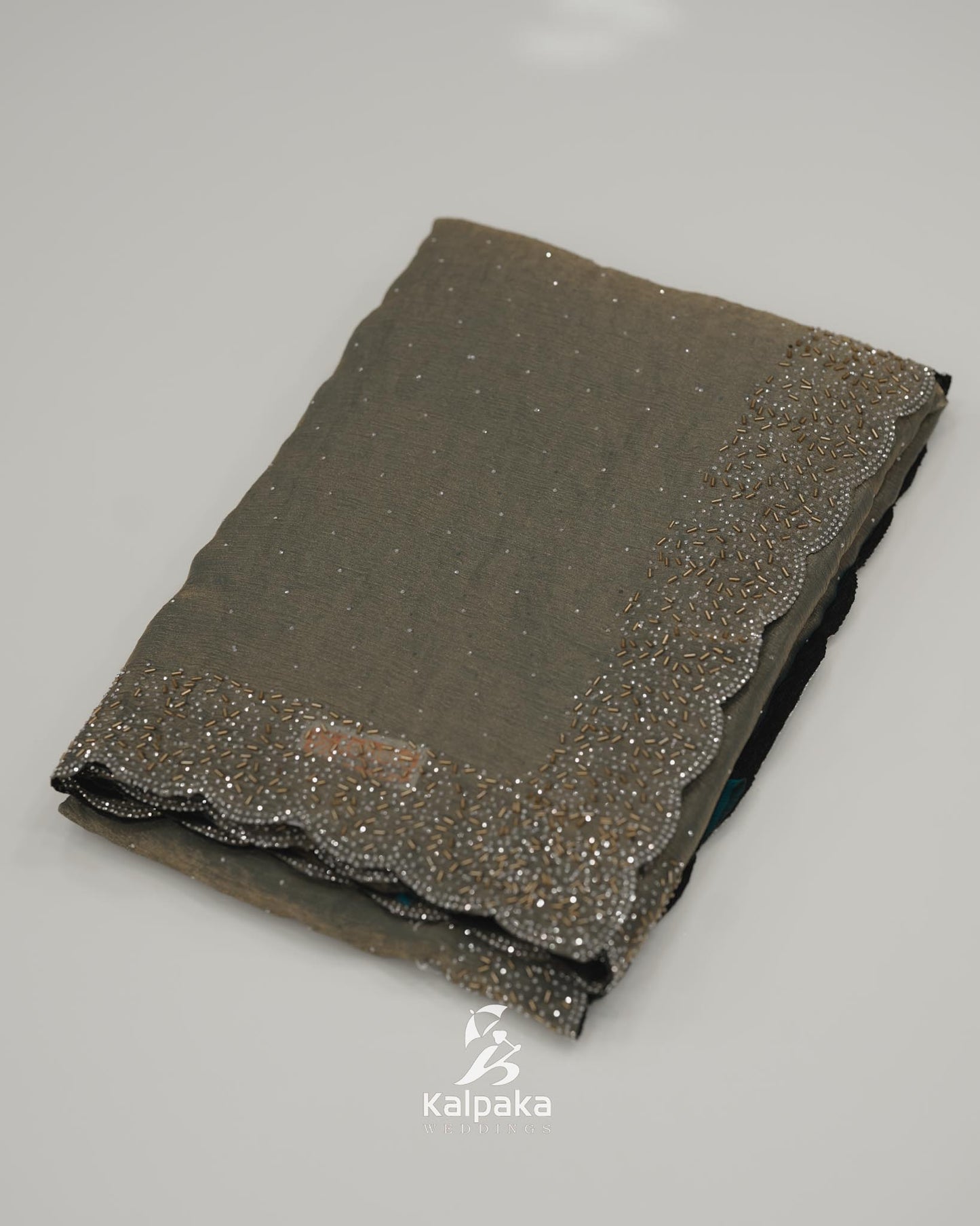 Teal blue and golden double shade Fancy Saree with Stone Work Border đ¸